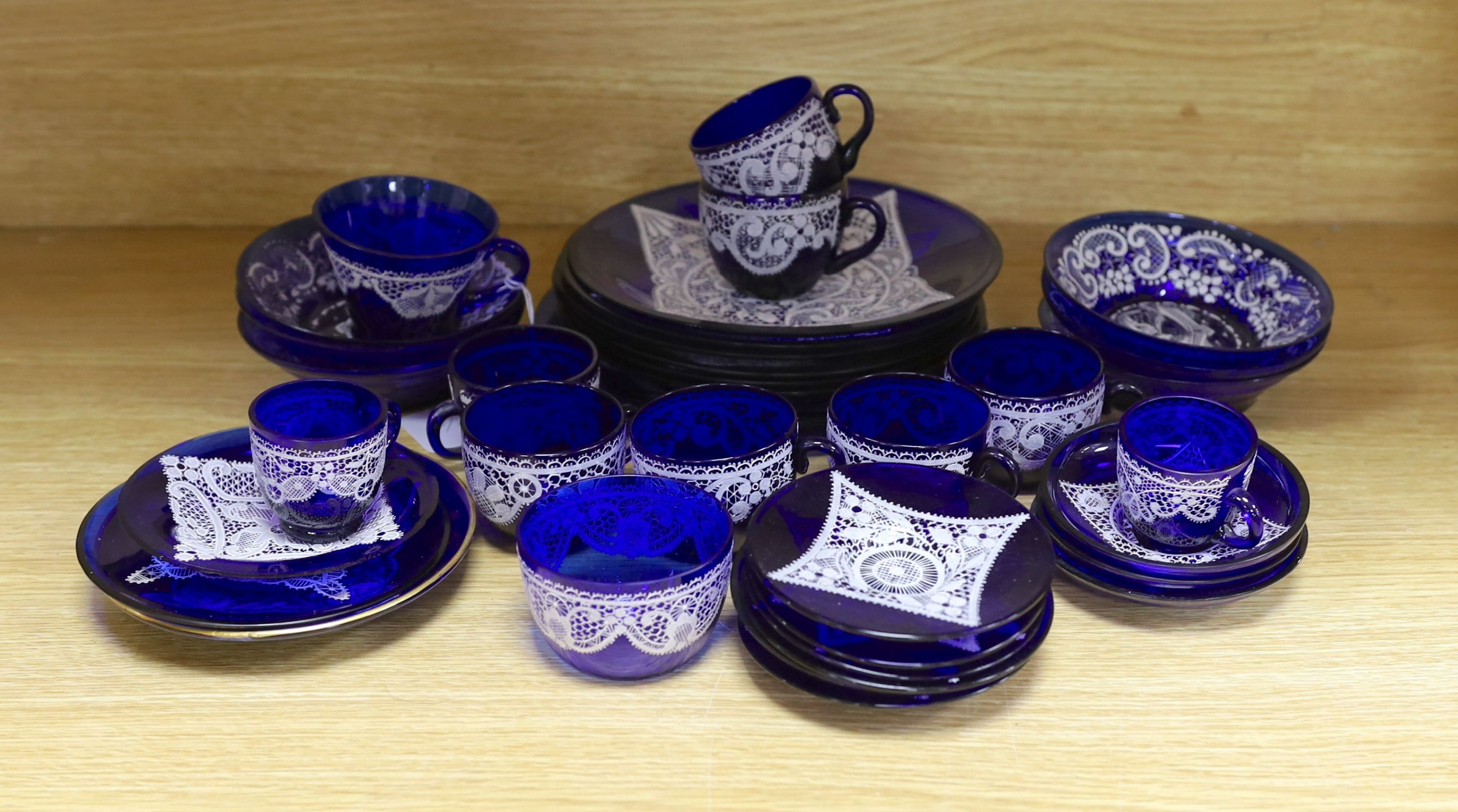 A quantity of Venetian lace pattern enamelled glass teaware